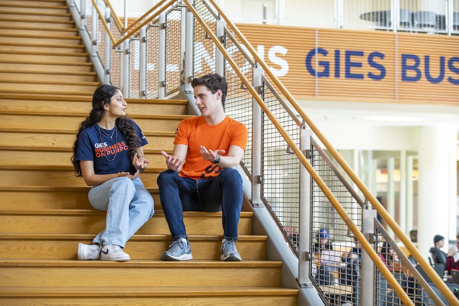 Gies students talking on the stairs